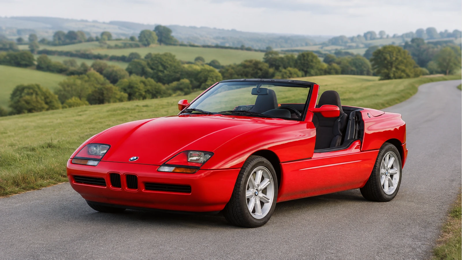 BMW Z1 с опущенными в пороги дверями и сложенным мягким верхом.