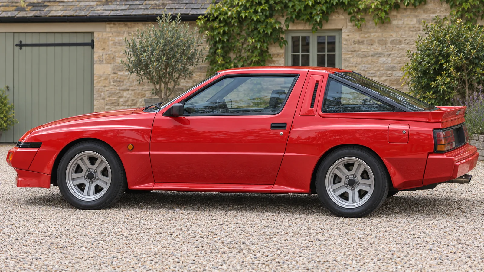 Mitsubishi Starion, дорожное ширококузовное купе 1988 года, боковой вид